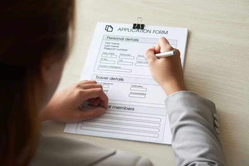 Prospective tenant filling out a rental application form